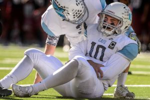 Trent Nelson  |  The Salt Lake Tribune Sky View quarterback Garrison Beach (10) grimaces in pain after fumbling the ball, as Sky View faces Herriman in a 5A high school football semifinal game at Rice-Eccles Stadium in Salt Lake City, Friday November 13, 2015.