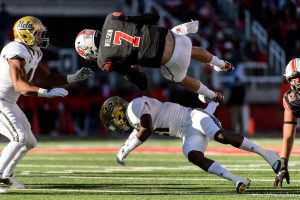 Trent Nelson  |  The Salt Lake Tribune Utah Utes quarterback Travis Wilson (7) flips over UCLA Bruins defensive back Tahaan Goodman (21) as the University of Utah hosts UCLA, NCAA football at Rice-Eccles Stadium in Salt Lake City, Saturday November 21, 2015.