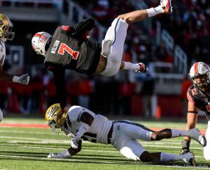 Trent Nelson  |  The Salt Lake Tribune Utah Utes quarterback Travis Wilson (7) flips over UCLA Bruins defensive back Tahaan Goodman (21) as the University of Utah hosts UCLA, NCAA football at Rice-Eccles Stadium in Salt Lake City, Saturday November 21, 2015.