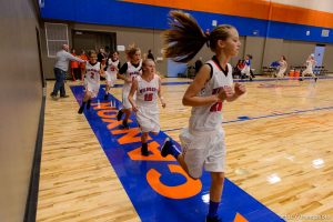 Trent Nelson  |  The Salt Lake Tribune Players on the court at Water Canyon School in Hildale as the school's girls' team warms up to play the first high school basketball game in a gym that used to be the FLDS bishop's storehouse, Wednesday December 2, 2015.