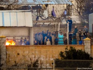 Trent Nelson  |  The Salt Lake Tribune People look on as a fire burns at the clinic in Hildale, Wednesday December 2, 2015.