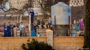 Trent Nelson  |  The Salt Lake Tribune People look on as a fire burns at the clinic in Hildale, Wednesday December 2, 2015.