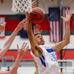 Trent Nelson  |  The Salt Lake Tribune Bingham's Samuta Avea (32) pulls down a rebound as Bingham plays Olympus in the first round of the boys' basketball Elite 8 Tournament at American Fork High School, Thursday December 10, 2015.