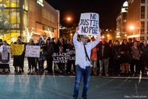 Trent Nelson  |  The Salt Lake Tribune Protesters occupy the intersection of 100 South State Street to protest the police shooting of 17-year-old Abdi Mohamed on Saturday night, Monday February 29, 2016.