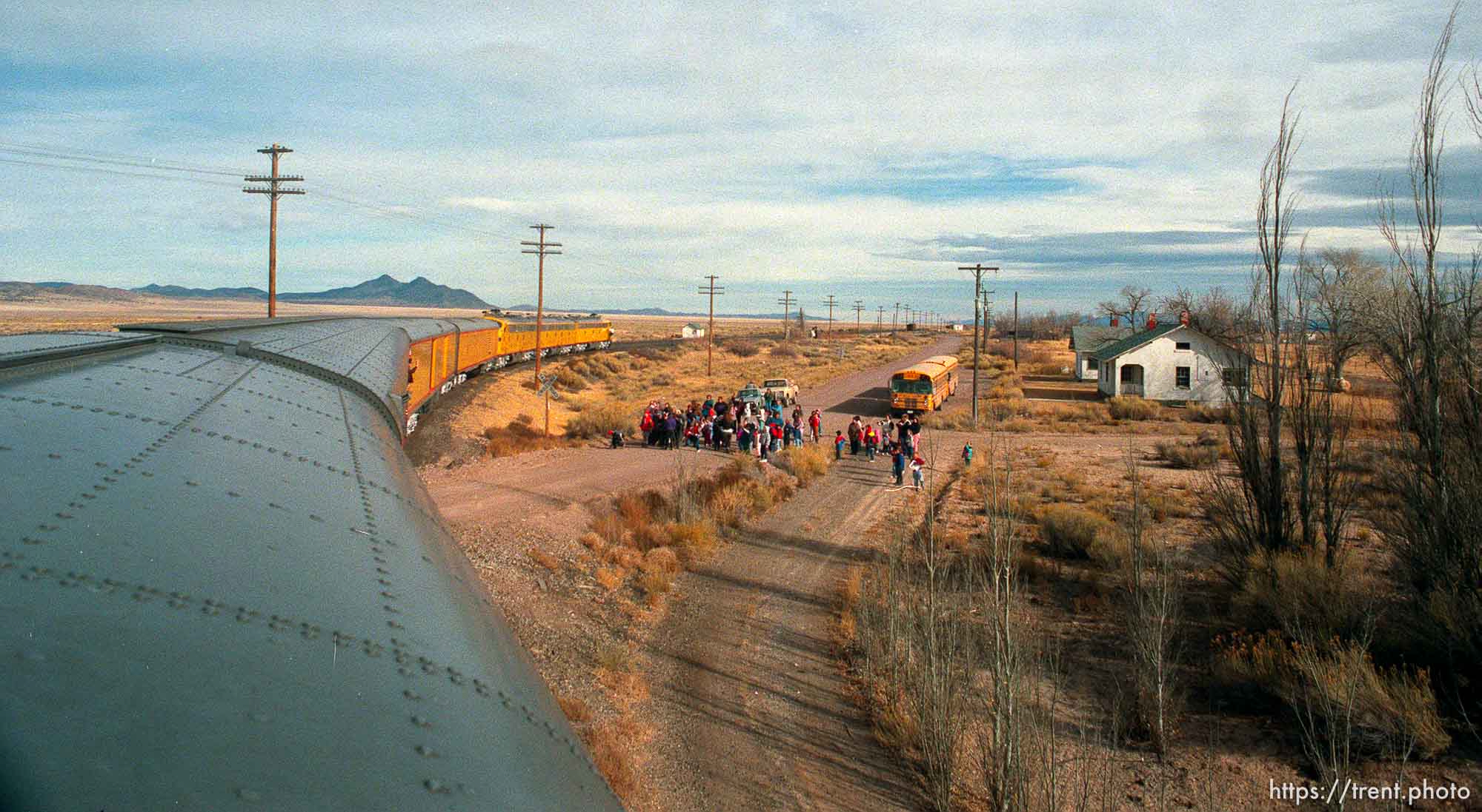 People wave to the the Governor's Centennial Train in the tiny town of Lund