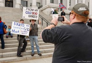 Trent Nelson  |  The Salt Lake Tribune
Josh Harris and Dave Larson pose for a photograph (being taken by Joe Harris) at a gun rally on the steps of the state capitol Friday, February 8, 2013 in Salt Lake City.