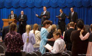 Trent Nelson  |  The Salt Lake Tribune
Sam Allred leads the conjuration in a hymn during a church service of ex-FLDS members Sunday, February 17, 2013 in Hildale. Left to right on stage are William E. Jessop, Garth Warner, Allred, Dan Timpson and Royce Jessop