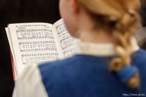Trent Nelson  |  The Salt Lake Tribune
A young girl sings the hymn, 