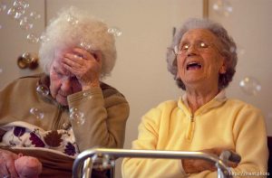 Music Therapist Maren Ernstrom leads a group of seniors in an hour of sing-a-long at the Cottonwood Presbyterian Church. Music time is one part of a day's activities in the adult daycare program.; 02.20.2003, 11:56:47 AM