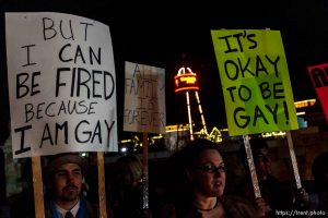 Approximately thirty protesters (including Josh Adamson (left) and Rebecca Huggins (center)) were on hand as the conservative Sutherland Institute held an educational forum Thursday February 5, 2009 on its 