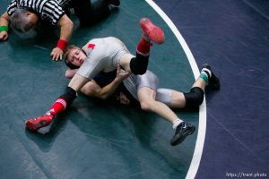 Bjorn Rasmussen, Millard, and James Madsen, Manti (silver/red) in the 119lb 2A high school wrestling quarterfinals at Utah State Valley College.
2.10.2005