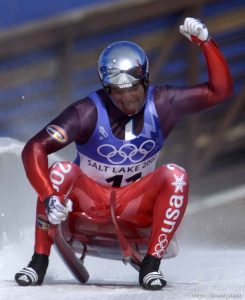 American Adam Heidt celebrates his final run, ending up in fourth place in the Men's Luge competition. Final round, Mens Luge, Monday morning at the Utah Olympic Park, 2002 Olympic Winter Games.
Photo by Trent Nelson 02.11.2002, 12:54:05 PM