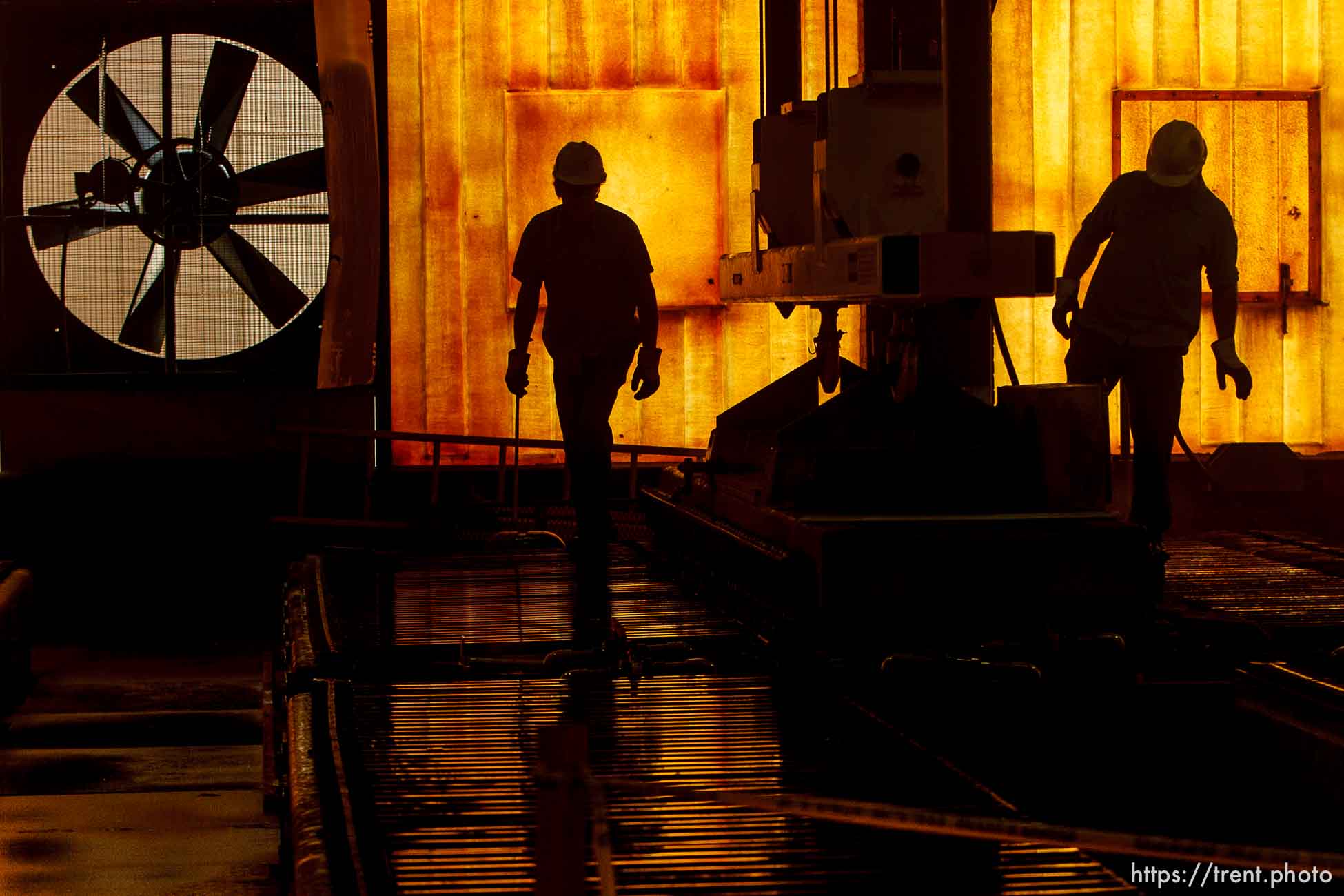 Magna -  Thomas Backman (left) and Kris Canham working in the electro-refining process at the Kennecott Utah Copper Refinery Thursday February 12, 2009. Rio Tinto's governing boards recommended Thursday that shareholders sell a portion of the company to Aluminum Corp. of China, or Chinalco, creating joint ventures to mine aluminum, copper and iron ore. Chinalco will increase its shareholdings in Rio Tinto from 9.3 percent to 18 percent, a Kennecott Utah Copper statement said. Thursday, February 12, 2009.; 02.12.2009.