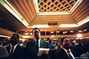 Mormons sing at a meeting where LDS President Gordon B. Hinckley spoke in the Zuna PF Building.