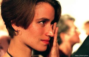 Liesl Armstrong wipes a tear after singing a rousing closing hymn with the choir at a meeting where LDS president Gordon B. Hinckley spoke at the National Exhibition Center.