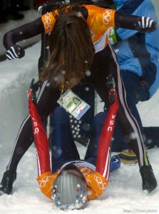 USA skeleton athletes Lea Ann Parsley (top, silver medalist) and Tristan Gale (gold medalist) celebrate. Skeleton, Wednesday morning at the Utah Olympic Park, 2002 Olympic Winter Games.; 02.20.2002, 11:56:56 AM