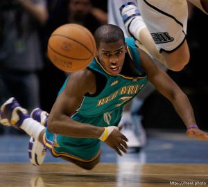 Chris Paul dives for loose ball. Utah Jazz vs. New Orleans/Oklahoma City Hornets NBA Basketball.