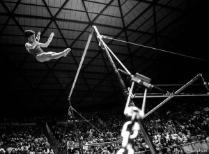 Utah's Marilyn Ekdahl on the bars (this is not her dismount, but an aerial stunt) at BYU vs. Utah gymnastics.
