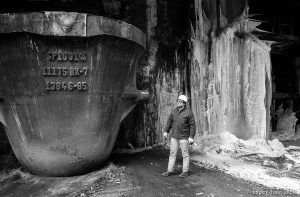 Worker and icicles and big pot at Geneva Steel.