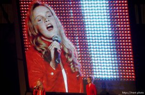 Young woman sings the National Anthem to open the Olympic Command Performance Rodeo Saturday night,  Davis County Legacy Center, 2002 Olympic Winter Games.; 02.09.2002, 8:15:43 PM