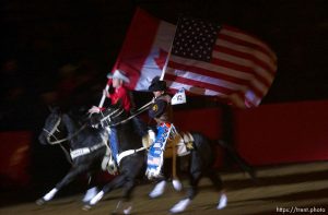 Cowboys bring in the American and Canadian flags. Olympic Command Performance Rodeo Saturday night,  Davis County Legacy Center, 2002 Olympic Winter Games.; 02.09.2002, 8:16:05 PM