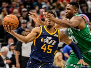(Trent Nelson | The Salt Lake Tribune)   Utah Jazz vs. Boston Celtics, NBA basketball in Salt Lake City, Wednesday March 28, 2018. Utah Jazz guard Donovan Mitchell (45) and Boston Celtics forward Guerschon Yabusele (30).