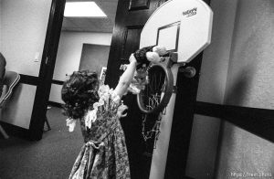 Girl dunks a doll in LDS nursery class