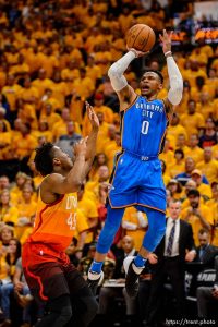 (Trent Nelson | The Salt Lake Tribune)   Utah Jazz host the Oklahoma City Thunder, Game 3, NBA playoff basketball in Salt Lake City, Saturday April 21, 2018. Oklahoma City Thunder guard Russell Westbrook (0) shoots over Utah Jazz guard Donovan Mitchell (45).