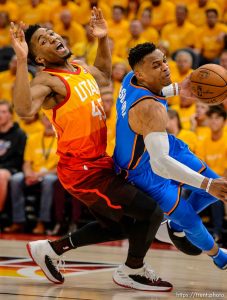 (Trent Nelson | The Salt Lake Tribune)   Utah Jazz host the Oklahoma City Thunder, Game 3, NBA playoff basketball in Salt Lake City, Saturday April 21, 2018. Utah Jazz guard Donovan Mitchell (45) fouls Oklahoma City Thunder guard Russell Westbrook (0).