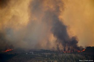 (Trent Nelson | The Salt Lake Tribune)The Dollar Ridge Fire threatens a structure, as seen from Fruitland in Duchesne County, Tuesday July 3, 2018.