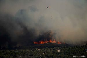 (Trent Nelson | The Salt Lake Tribune)Helicopters make drops on the Dollar Ridge Fire near Fruitland in Duchesne County, Tuesday July 3, 2018.