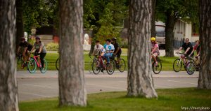 (Trent Nelson | The Salt Lake Tribune) Cyclists gather and ride around Salt Lake City's Liberty Park, Saturday July 21, 2018, in remembrance of Cameron Hooyer, a rider who was killed by a FrontRunner train during a 999 Ride on Thursday.