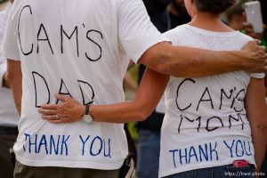 (Trent Nelson | The Salt Lake Tribune) Cyclists gather and ride around Salt Lake City's Liberty Park, Saturday July 21, 2018, in remembrance of Cameron Hooyer, a rider who was killed by a FrontRunner train during a 999 Ride on Thursday. Hooyer's parents Mark and Carla Hooyer.