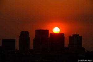 (Trent Nelson | The Salt Lake Tribune)
The sun sets over a hazy Salt Lake City, Monday Aug. 6, 2018.