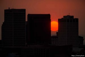 (Trent Nelson | The Salt Lake Tribune)
The sun sets over a hazy Salt Lake City, Monday Aug. 6, 2018.