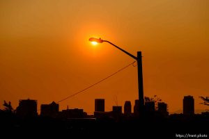 (Trent Nelson | The Salt Lake Tribune) The sun sets over a hazy Salt Lake City, Monday Aug. 6, 2018.