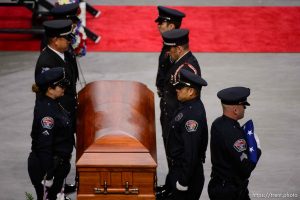 (Trent Nelson | The Salt Lake Tribune)   West Valley City police officers perform a flag presentation for family members at funeral services for Jill Robinson, a West Valley City code-enforcement officer killed on the job last week. The service took place at the Maverik Center in West Valley City on Friday Aug. 17, 2018.