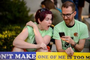 (Trent Nelson | The Salt Lake Tribune)   Michelle and Steve Boyer watch Sam Young speak on a livestream after his hearing. People gathered in front of the LDS Church Administration Building Salt Lake City, Sunday Sept. 9, 2018 in support of Sam Young. Young was in a disciplinary hearing tonight after he made calls for changes to the church's youth interview process.