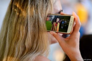 (Trent Nelson | The Salt Lake Tribune)   A woman listens as Sam Young speaks on a livestream after his hearing. People gathered in front of the LDS Church Administration Building Salt Lake City, Sunday Sept. 9, 2018 in support of Sam Young. Young was in a disciplinary hearing tonight after he made calls for changes to the church's youth interview process.
