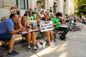 (Trent Nelson | The Salt Lake Tribune)   People watch as Sam Young speaks on a livestream after his hearing. People gathered in front of the LDS Church Administration Building Salt Lake City, Sunday Sept. 9, 2018 in support of Sam Young. Young was in a disciplinary hearing tonight after he made calls for changes to the church's youth interview process.