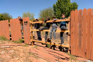 Trent Nelson  |  The Salt Lake Tribune
kids along fence, watching, Monday May 1, 2017.