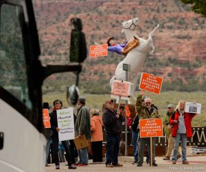 Trent Nelson  |  The Salt Lake Tribune People hold signs up for passing vehicles at a Monument Rally and Business Owner's Press Conference in Kanab, Wednesday May 10, 2017. The event was planned to occur in conjunction with Interior Secretary Ryan Zinke's visit to Grand Staircase-Escalante National Monument.