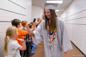 Trent Nelson  |  The Salt Lake Tribune
Water Canyon High School graduate Amy Barlow leads a procession of high-fives through Water Canyon Elementary prior to the high school's graduation ceremony in Hildale, Monday May 22, 2017. Two years ago the school had one graduate, this year twenty-five.