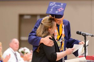Trent Nelson  |  The Salt Lake Tribune shirlee draper presents uep trust scholarship to roy jessop at Water Canyon High School's graduation ceremony in Hildale, Monday May 22, 2017. Two years ago the school had one graduate, this year twenty-five.