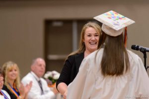 Trent Nelson  |  The Salt Lake Tribune shirlee draper presents uep trust scholarship to amy barlow at Water Canyon High School's graduation ceremony in Hildale, Monday May 22, 2017. Two years ago the school had one graduate, this year twenty-five.