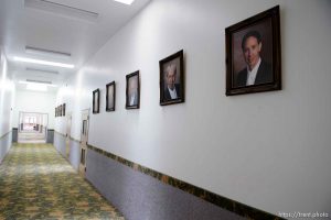 Trent Nelson  |  The Salt Lake Tribune
Portraits of FLDS prophets including, from right, Warren Jeffs, Rulon Jeffs, and Leroy Johnson, line the hallway in an FLDS school in Colorado City, Ariz., one of a few sites being considered for use as an LDS meetinghouse. The property is owned by the UEP land trust, which is seeking to dispose of its holdings. Tuesday May 23, 2017.