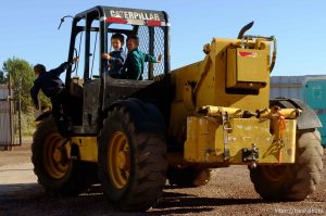 Trent Nelson  |  The Salt Lake Tribune pre-pubescent boys on heavy equipment at property being sold by hildale city, Wednesday September 14, 2016.