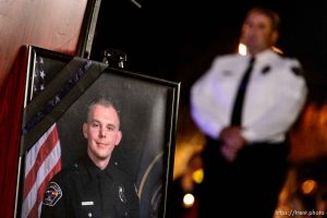 Trent Nelson  |  The Salt Lake Tribune West Valley City Police Chief Lee Russo stands near a portrait of West Valley City police officer Cody Brotherson, who was killed Sunday while apparently trying to lay down tire spikes to stop a fleeing stolen car. At  at a candlelight vigil, Wednesday November 9, 2016.