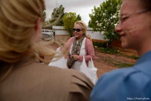 Trent Nelson  |  The Salt Lake Tribune
Christine Marie hands out relief kits to FLDS women in Colorado City, AZ, Tuesday May 9, 2017, as the locks are changed on the home next door by the UEP Trust.