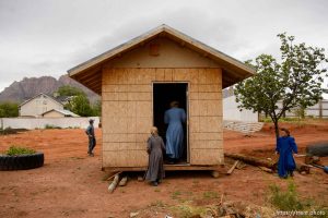 Trent Nelson  |  The Salt Lake Tribune An FLDS man removes a shed from a property in Colorado City, AZ, Tuesday May 9, 2017, as the locks are changed by the UEP Trust on the home next door.